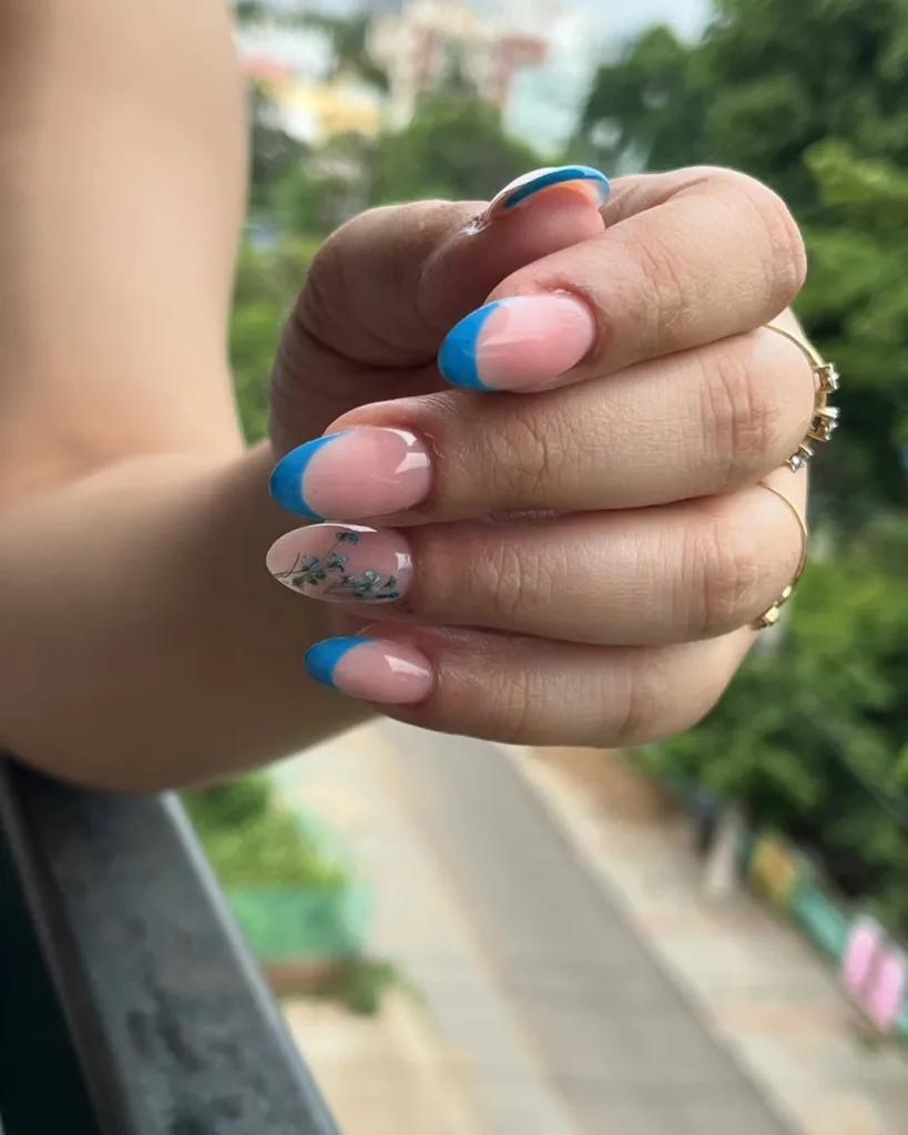Teal Blue French Tip Nails with Flowers