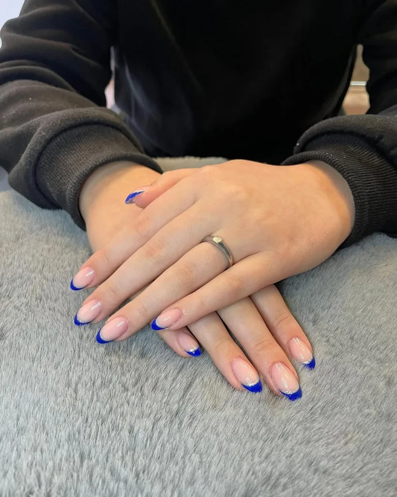 Almond Blue French Tip Nails with Nude base