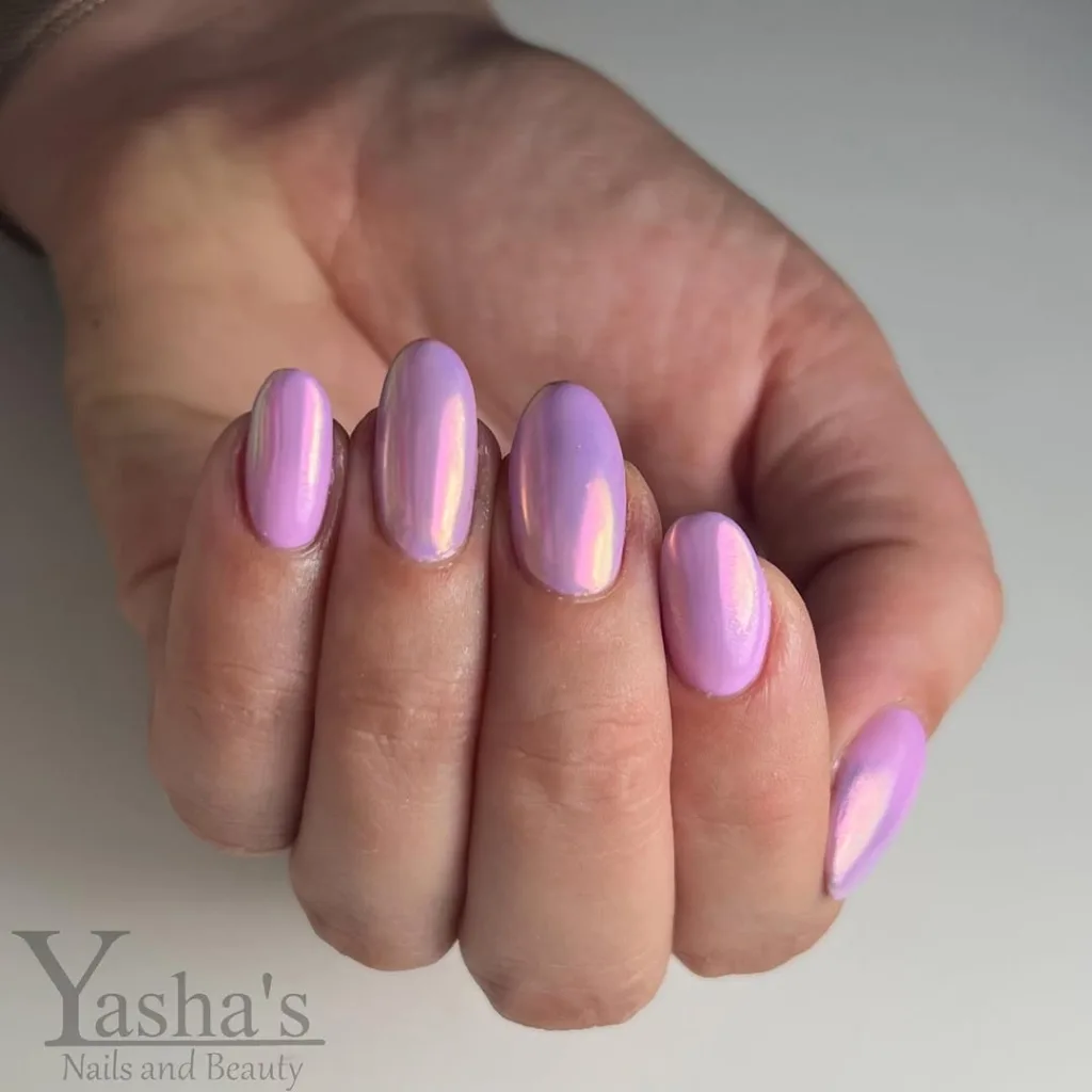 Lavender chrome nails with a dreamy iridescent effect.
