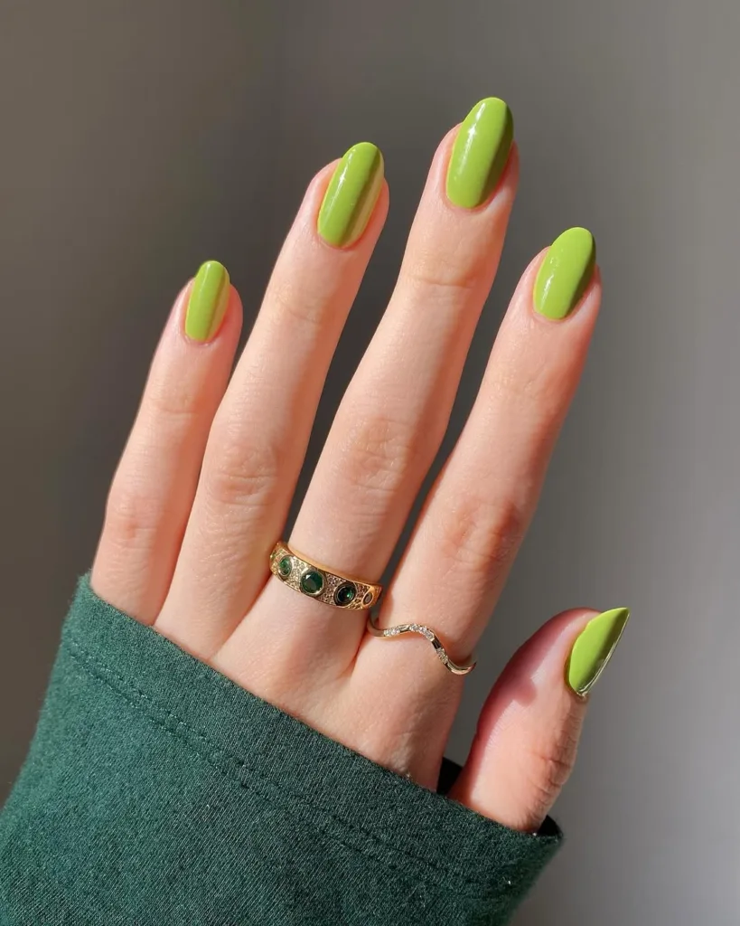 Bright lime-green nails with a high-gloss finish.