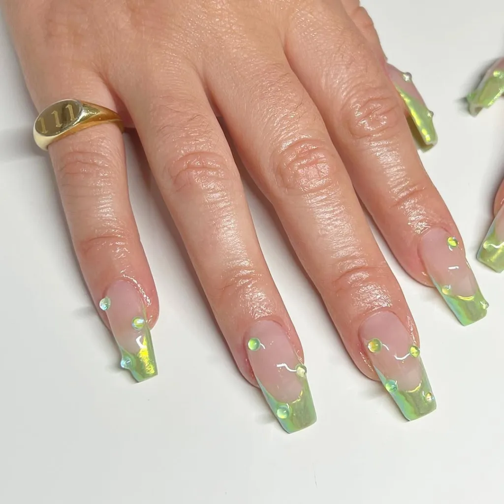 Green chrome French tips with 3D gel accents, whimsical and forest-inspired.