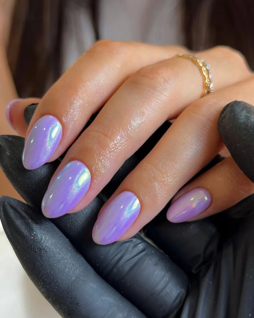 Almond-shaped purple chrome nails with a glossy finish for elegant spring styling.